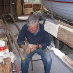 Ken busy sanding and varnishing oars