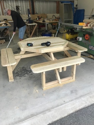 An outdoor table that seats 8 people, created by Alexandra Men's Shed
